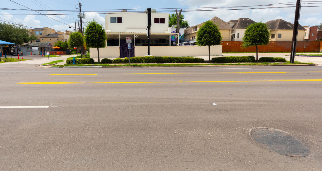 Completed street repairs on Washington Avenue near Malone Street.